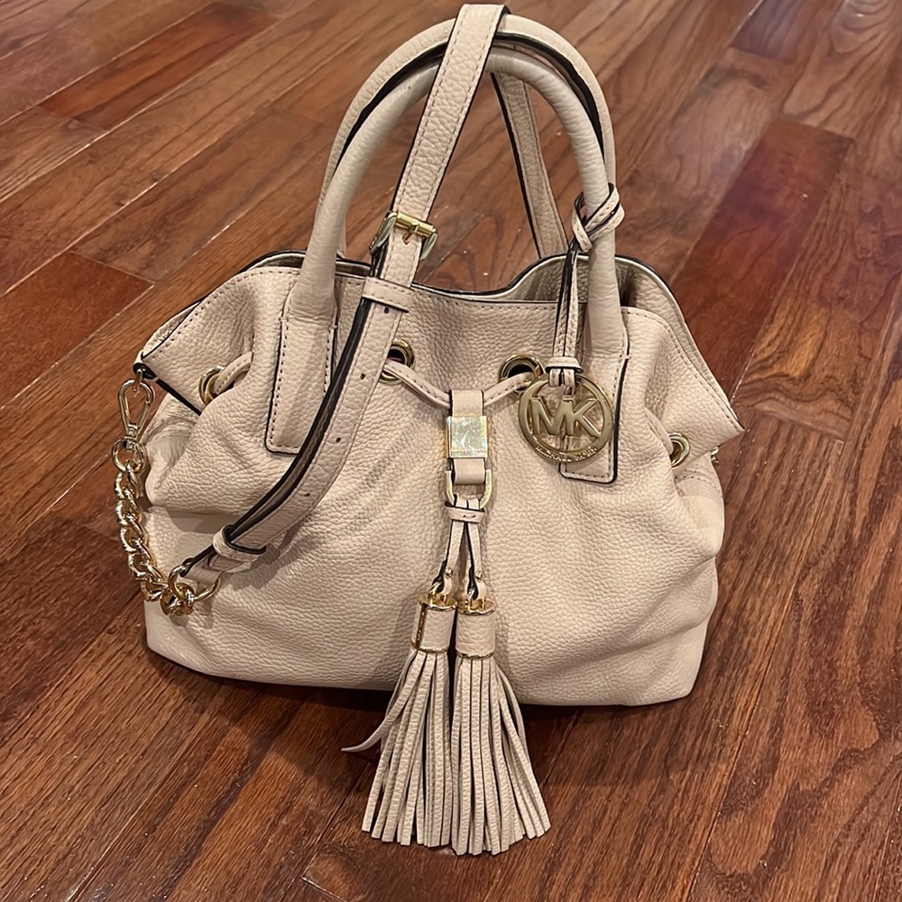Michael Kors pebbled leather handbag with tastle, removable strap.